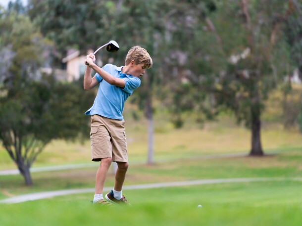  9 Year Old  Boy Golfing